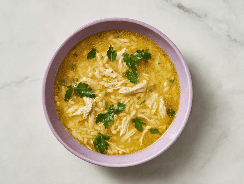 Italian penicillin soup served in lavender bowl with parsley garnish