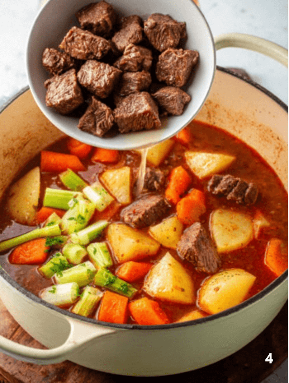 Adding browned beef to vegetables and broth for Hawaiian beef stew recipe step four