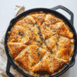 golden baked easy chicken pot pie with cream of chicken soup topped with sesame seeds