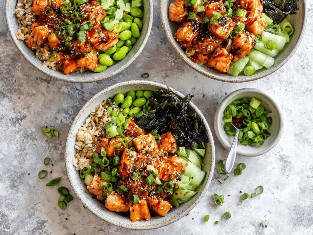 Teriyaki Salmon Rice Bowls with edamame, cucumber, nori, and spicy mayo